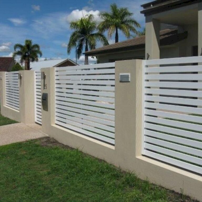 A fence that is made of white wood.